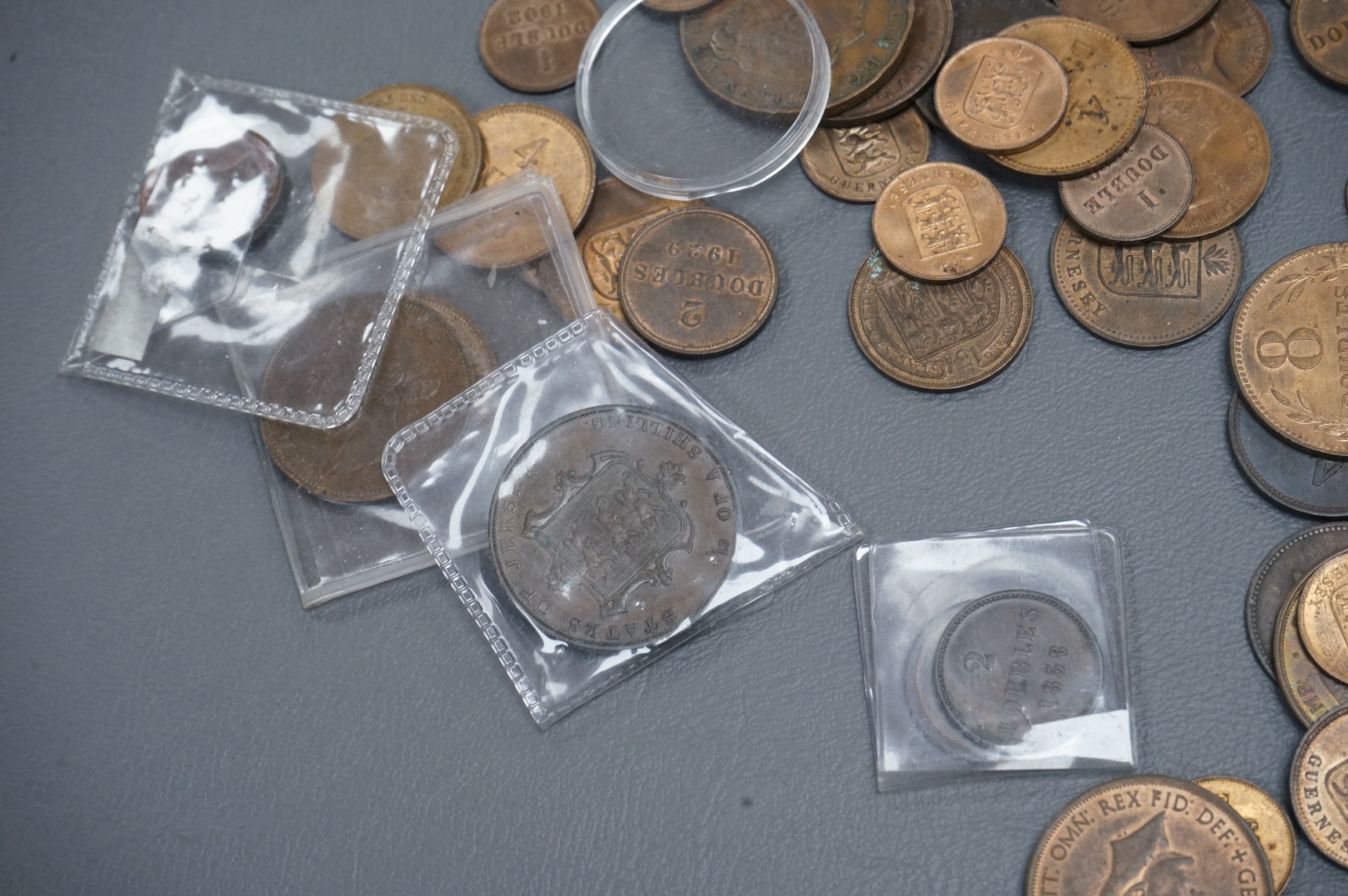 A collection of Guernsey and Channel Islands coins, Victoria to George V, many EF to UNC, Together with a C. Brooke rajah Sarawak, one cent, 1870, about EF